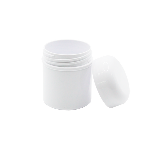 Boião de 50 ml em plástico branco, com tampa destacável, reciclável e reutilizável.